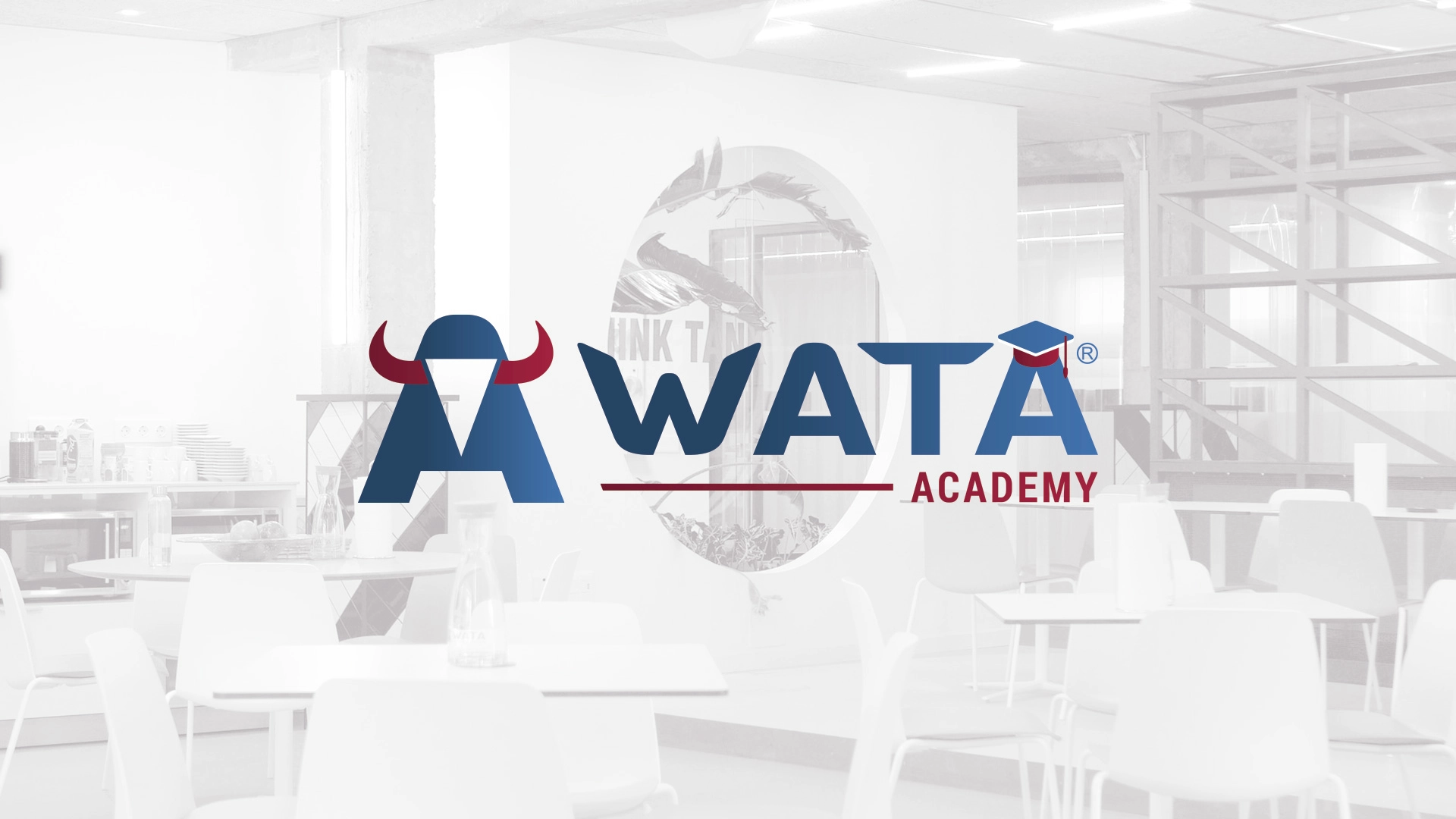 Logo der WATA-Akademie mit stilisiertem Stier-Design, das in der Trainingsstätte angezeigt wird
