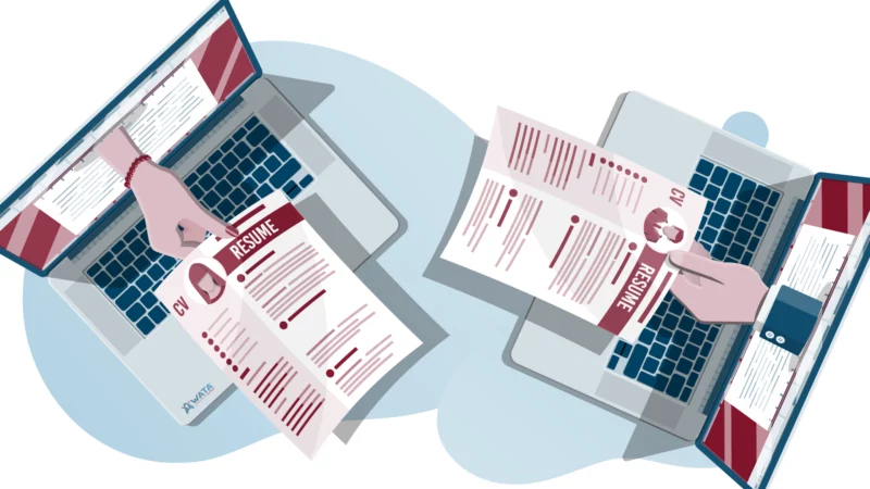 Two laptops facing each other, each with a hand reaching out through the screen to submit a CV — representing candidates applying remotely to WATA Factory.