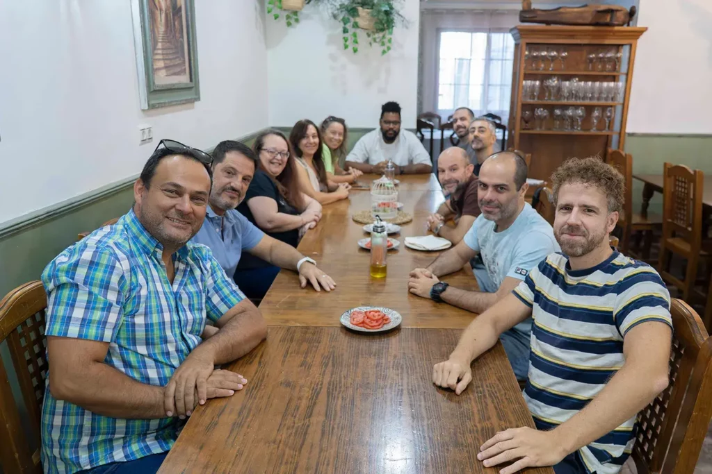 Andalusian breakfast table at WATA Factory’s All Hands: tomatoes, olive oil, and shared toasts.