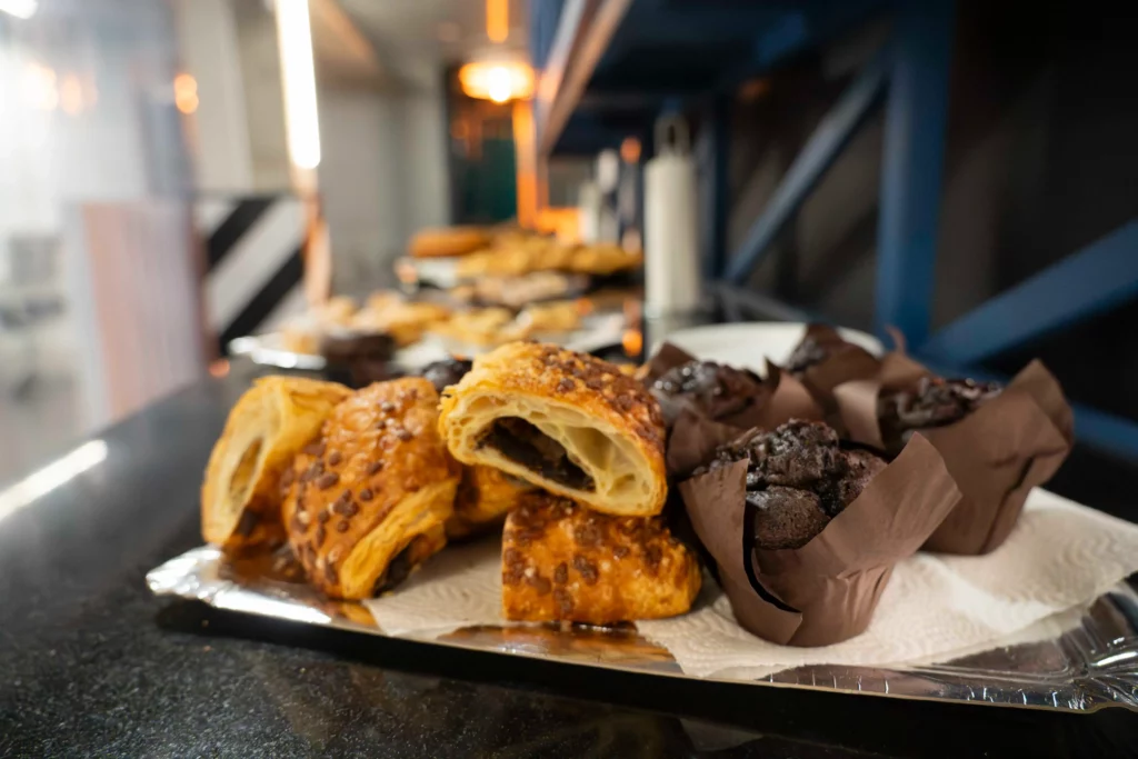 Breakfast buffet at WATA Factory with pastries before the Kubernetes training.