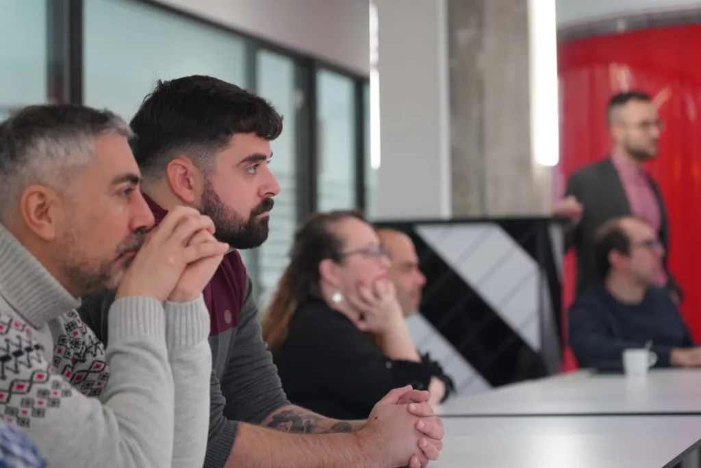 WATA Factory colleagues listening attentively to a presentation during the All Hands.