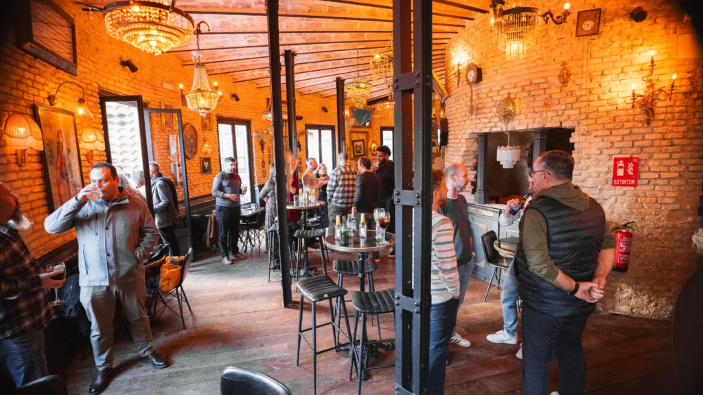 Wide view of a vintage-style venue with WATA Factory colleagues enjoying time together.