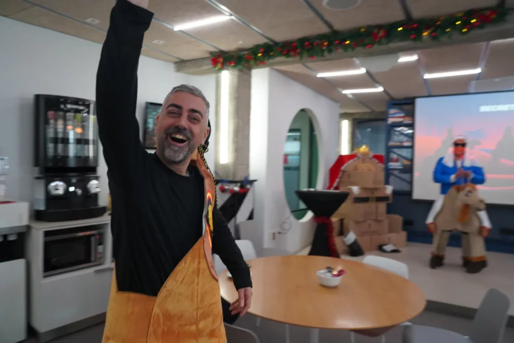 Juan Miguel G. greeting enthusiastically while dressed as an Iberian ham.