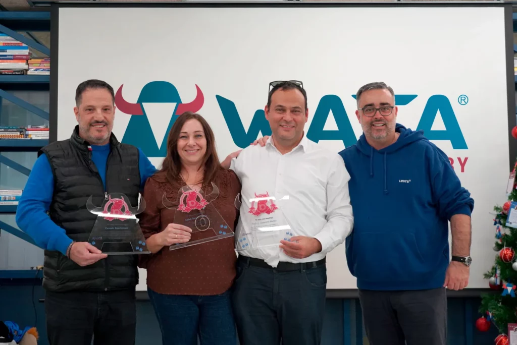 Germán T. posing with three of the attending colleagues honoured for ten years at WATA Factory.