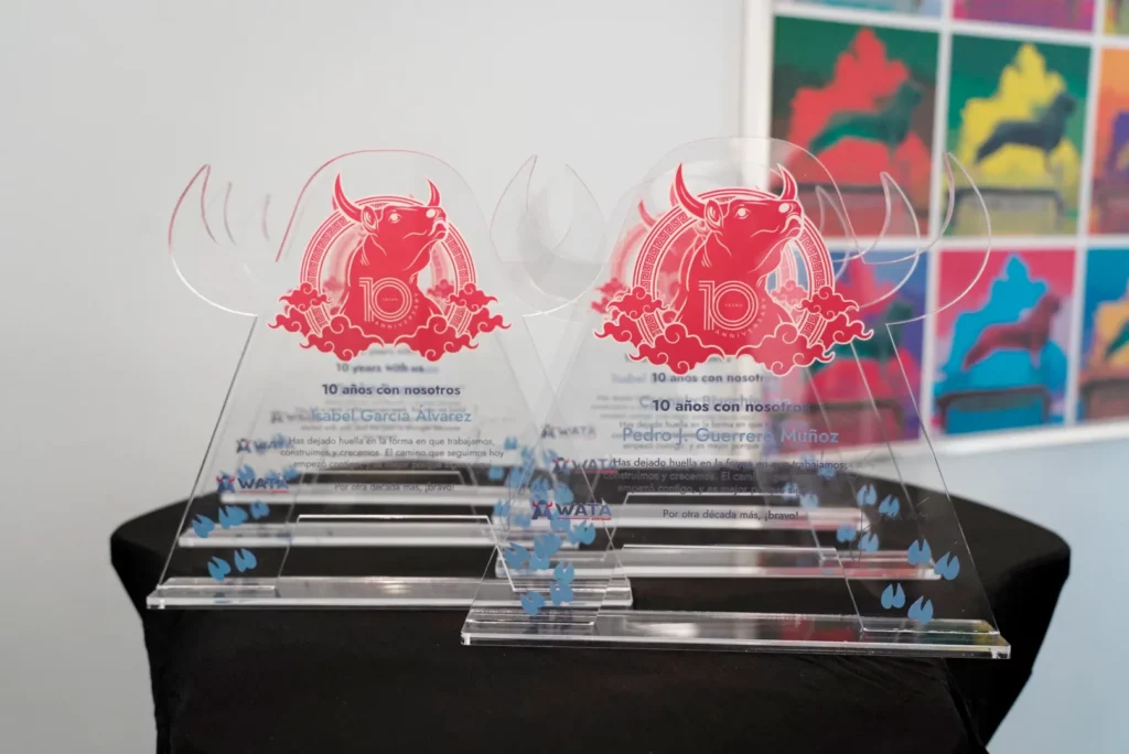 Close-up of commemorative plaques featuring the WATA Factory logo and an engraved bull.